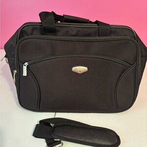 Black Travel Bag with Durable Fabric and Detachable Strap